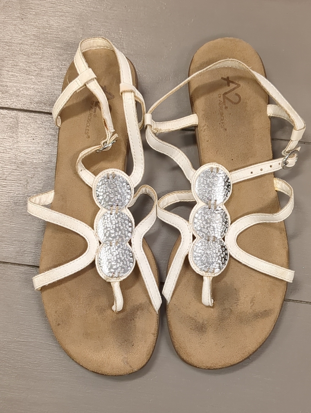 A2 By Aerosoles White T-Strap Sandals with Silver Medallions
